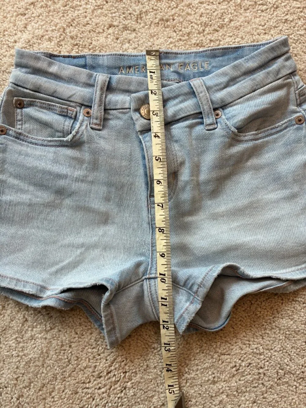 American Eagle Curvy High-Rise Shortie Stretch Jean Cross-Front Button Shorts - Picture 13 of 14